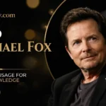 Michael J. Fox smiling on stage at a public appearance, wearing a dark blazer